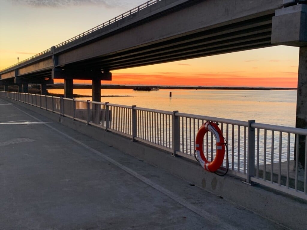 Sunrise over the Bonner Bridge Fishing Pier walkway at Oregon Inlet, Outer Banks