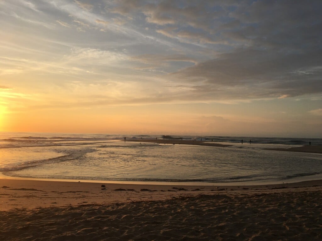 High tide covering the tip of Cape Point at sunrise